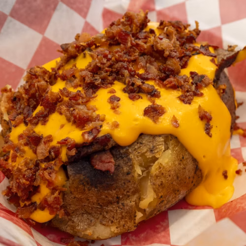 Baked jacket potato with crisp skin and toppings