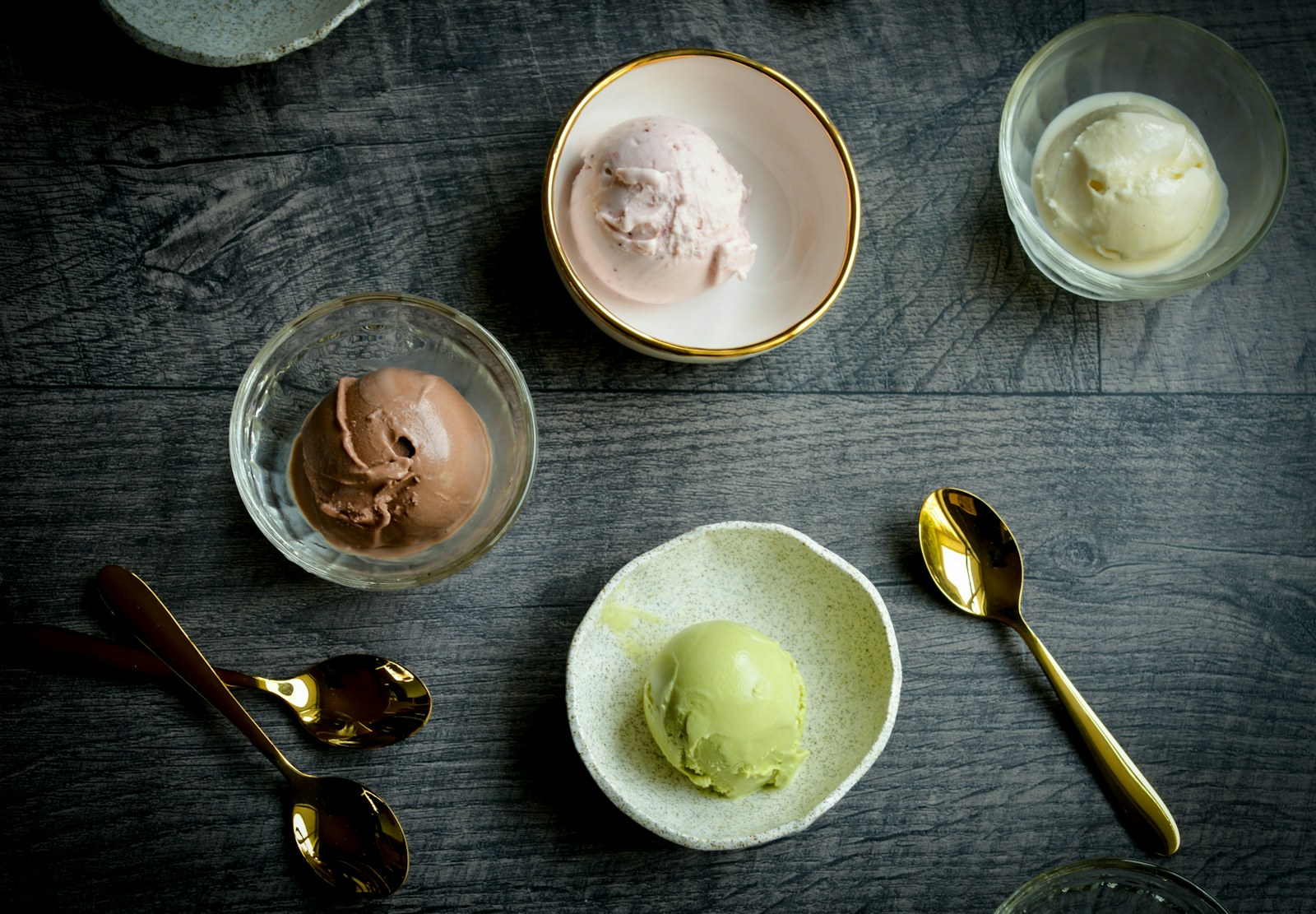 Assorted creamy frozen dessert scoops
