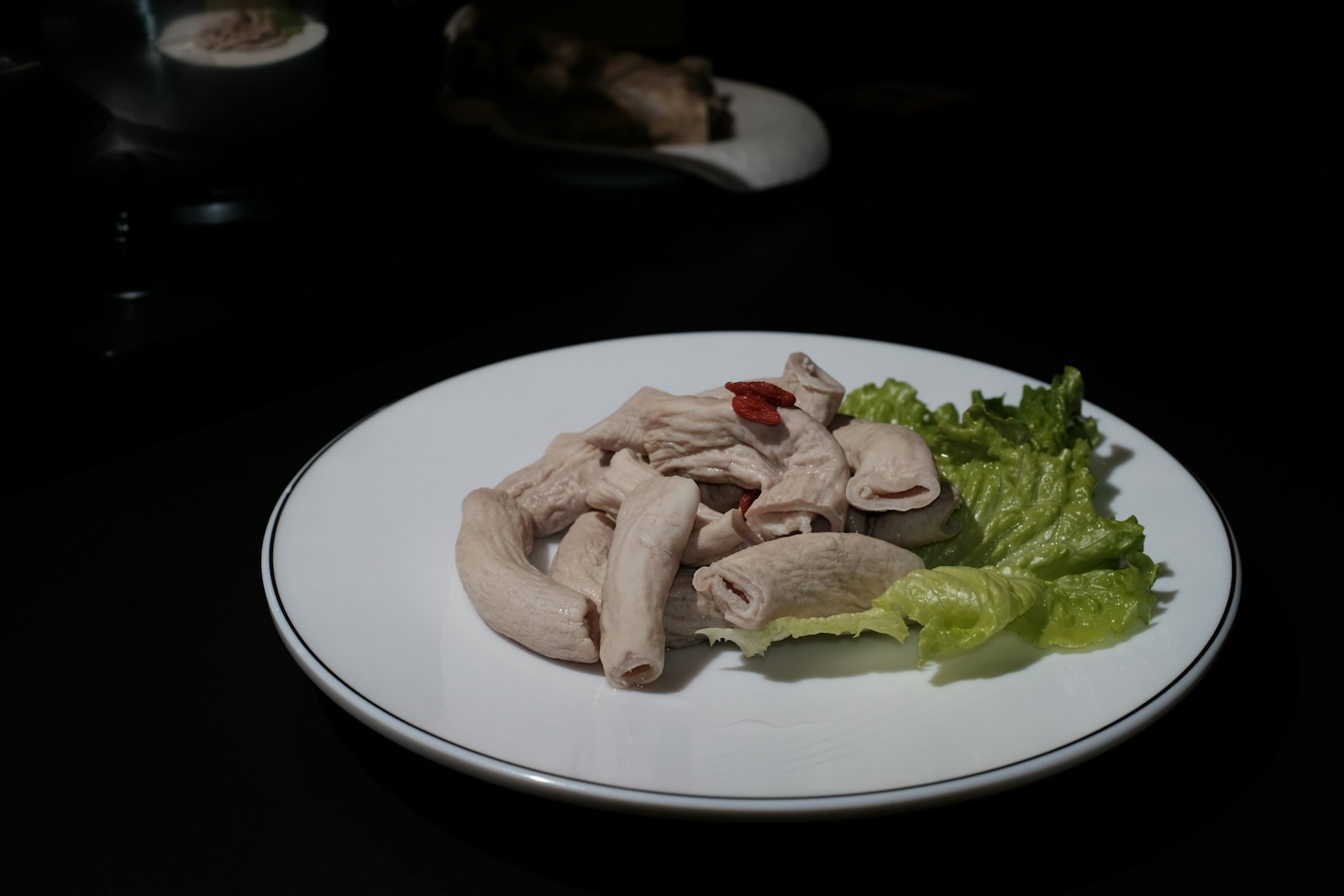 Braised chicken feet served on a plate