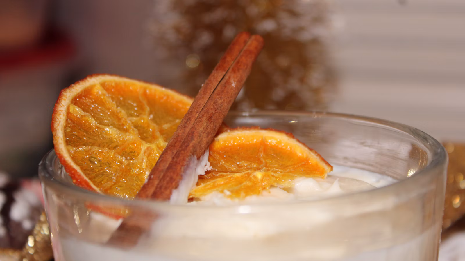 Creamy drink in a glass with a cinnamon stick
