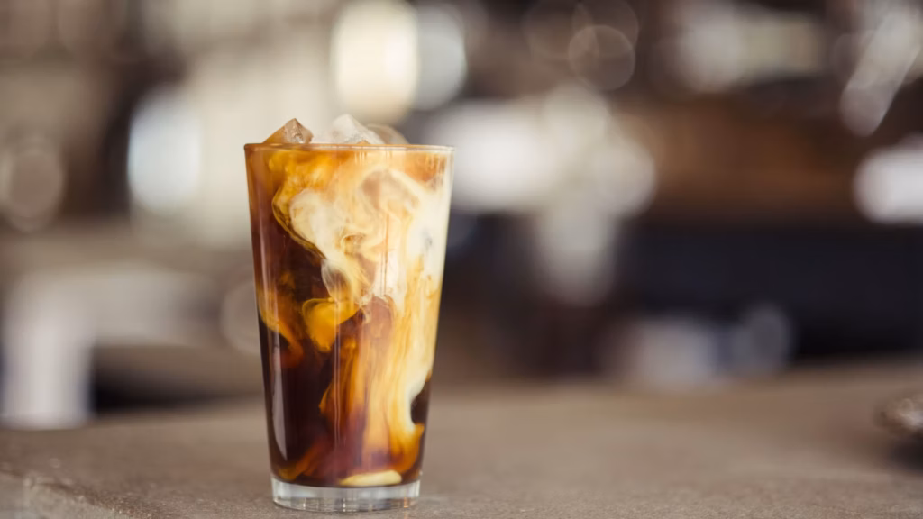 Iced coffee topped with a light layer of cold foam