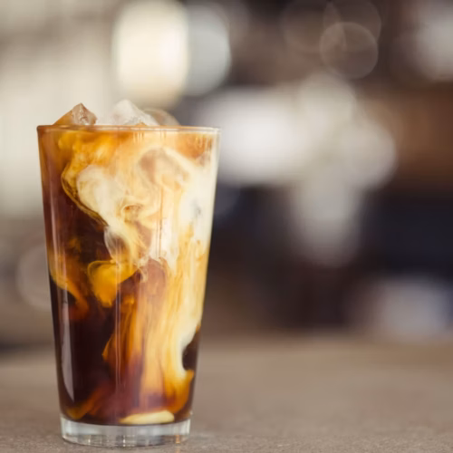 Iced coffee topped with a light layer of cold foam