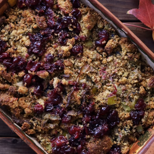 Cornbread dressing in a holiday serving dish