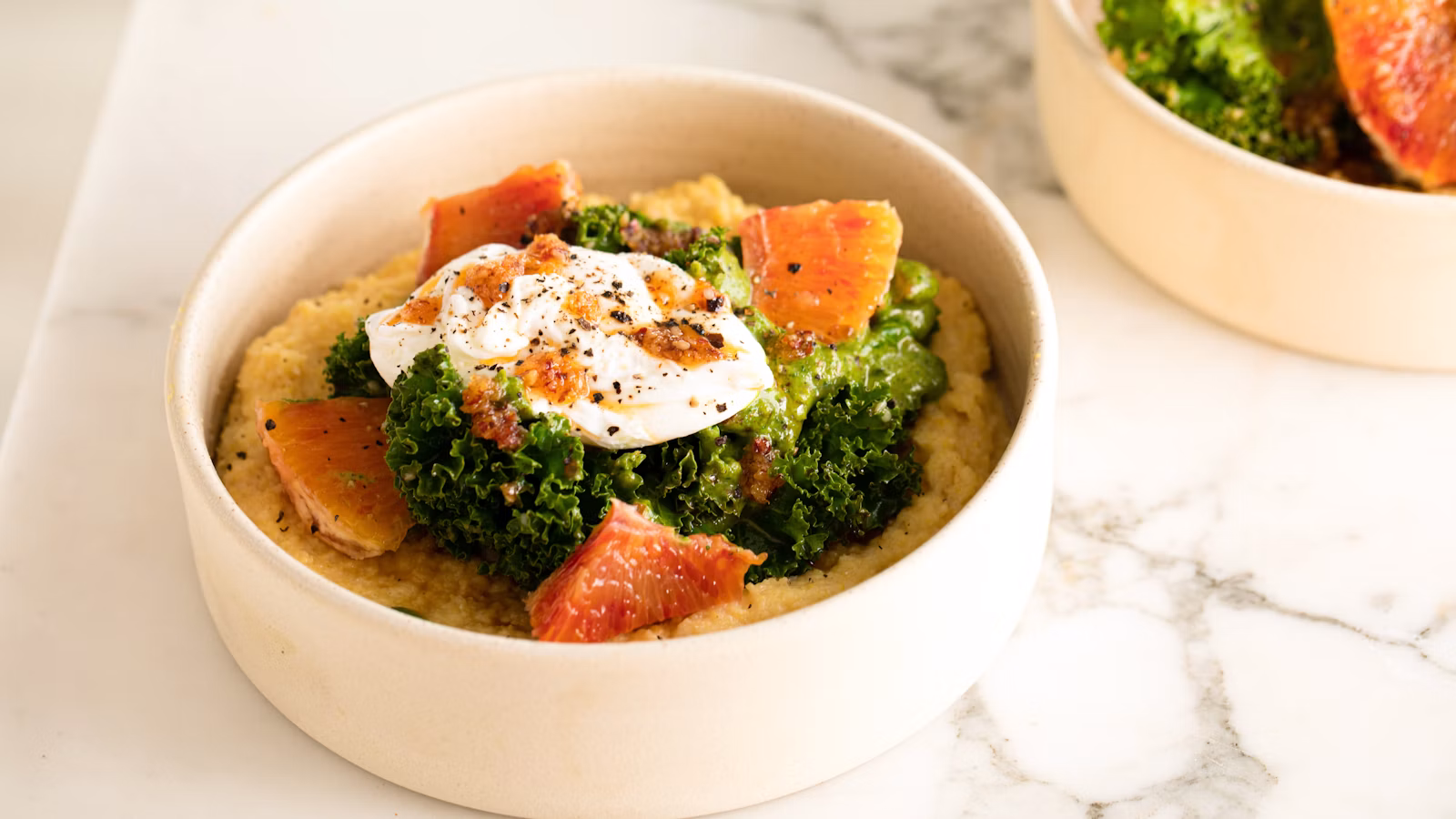 Creamy yellow polenta served in a shallow bowl