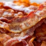 Crisp cooked thick-cut bacon strips