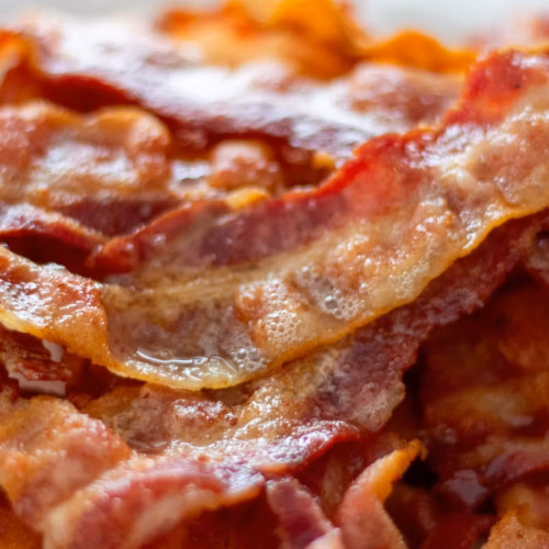 Crisp cooked thick-cut bacon strips