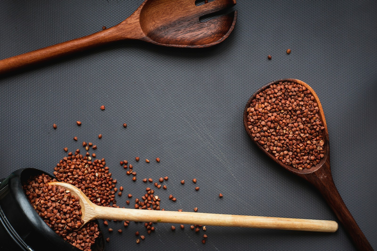 Ground coriander in a wooden spoon