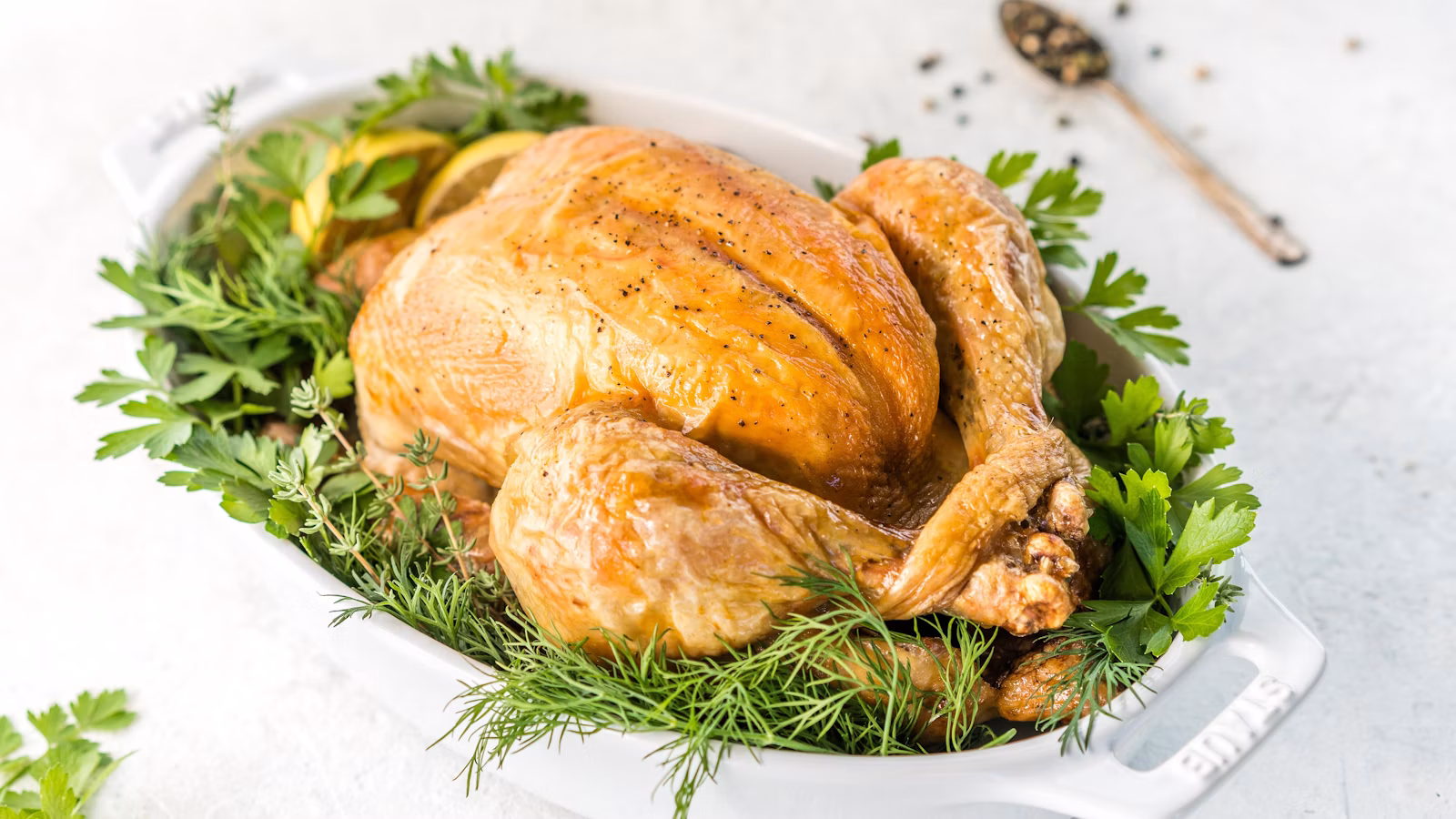 Whole roast bird finished with fresh herbs