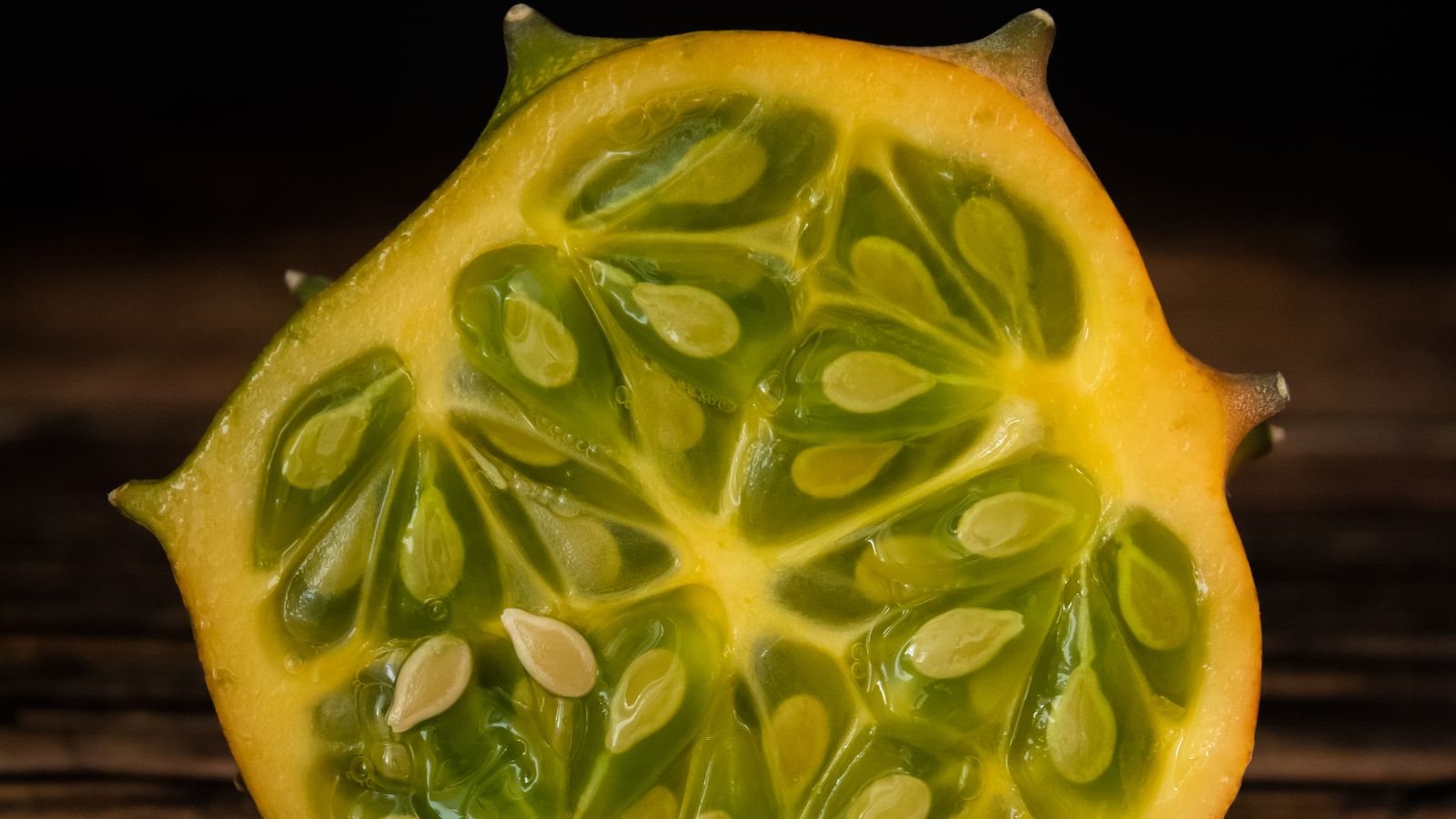 Sliced horned melon showing green seeded pulp