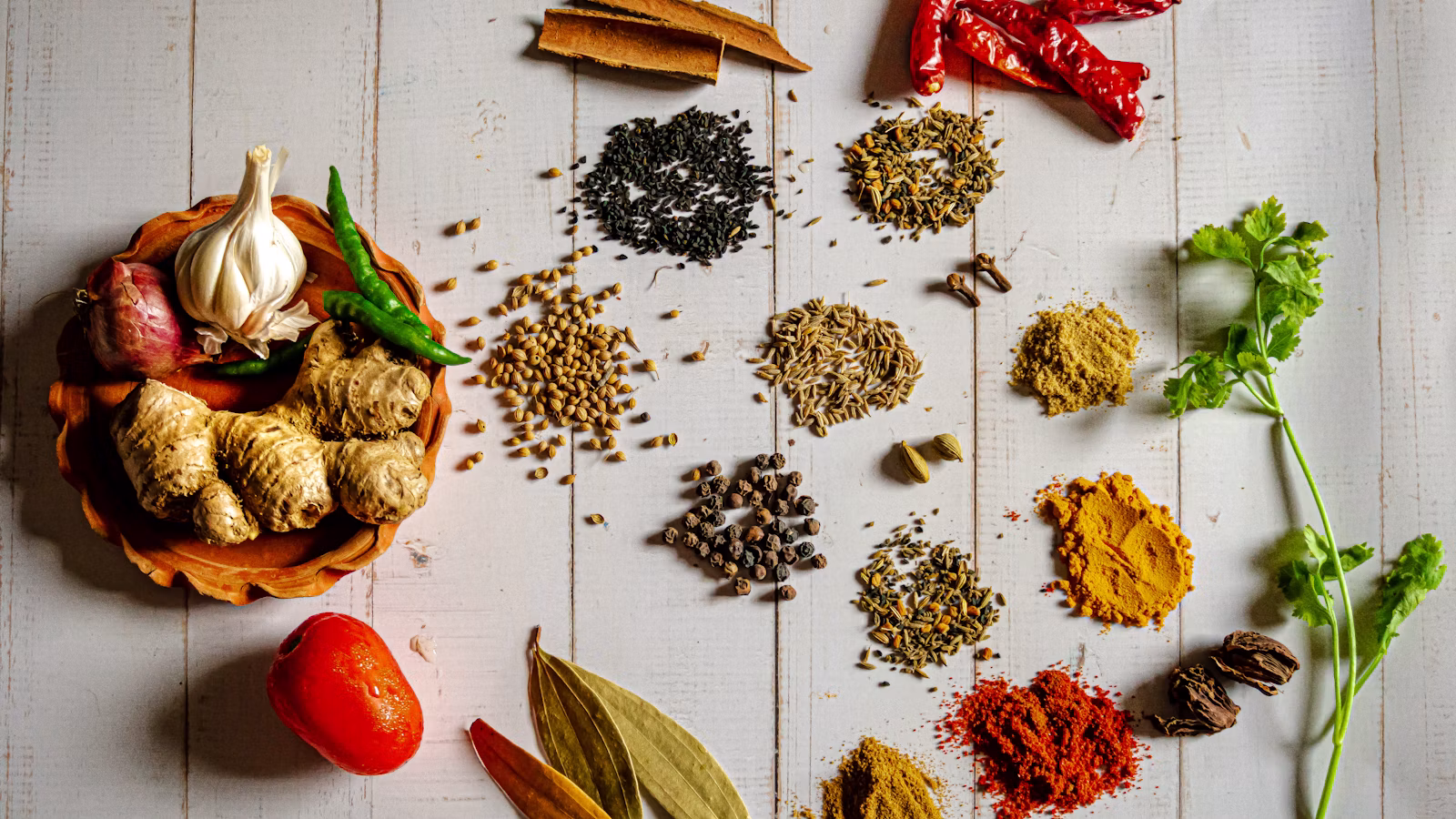 Colorful Indian spices arranged in small bowls