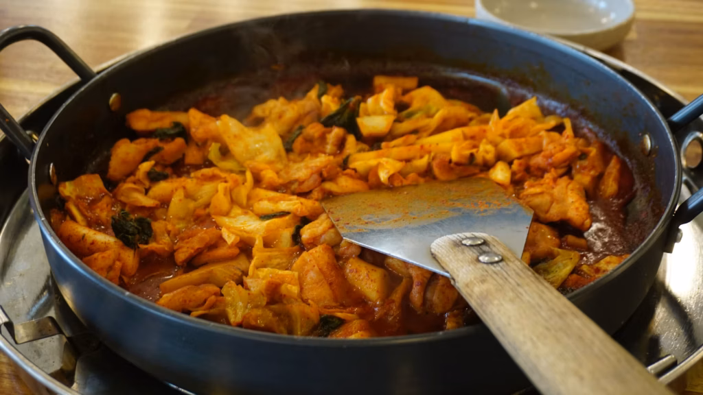 Spicy Korean dish cooking in a pan