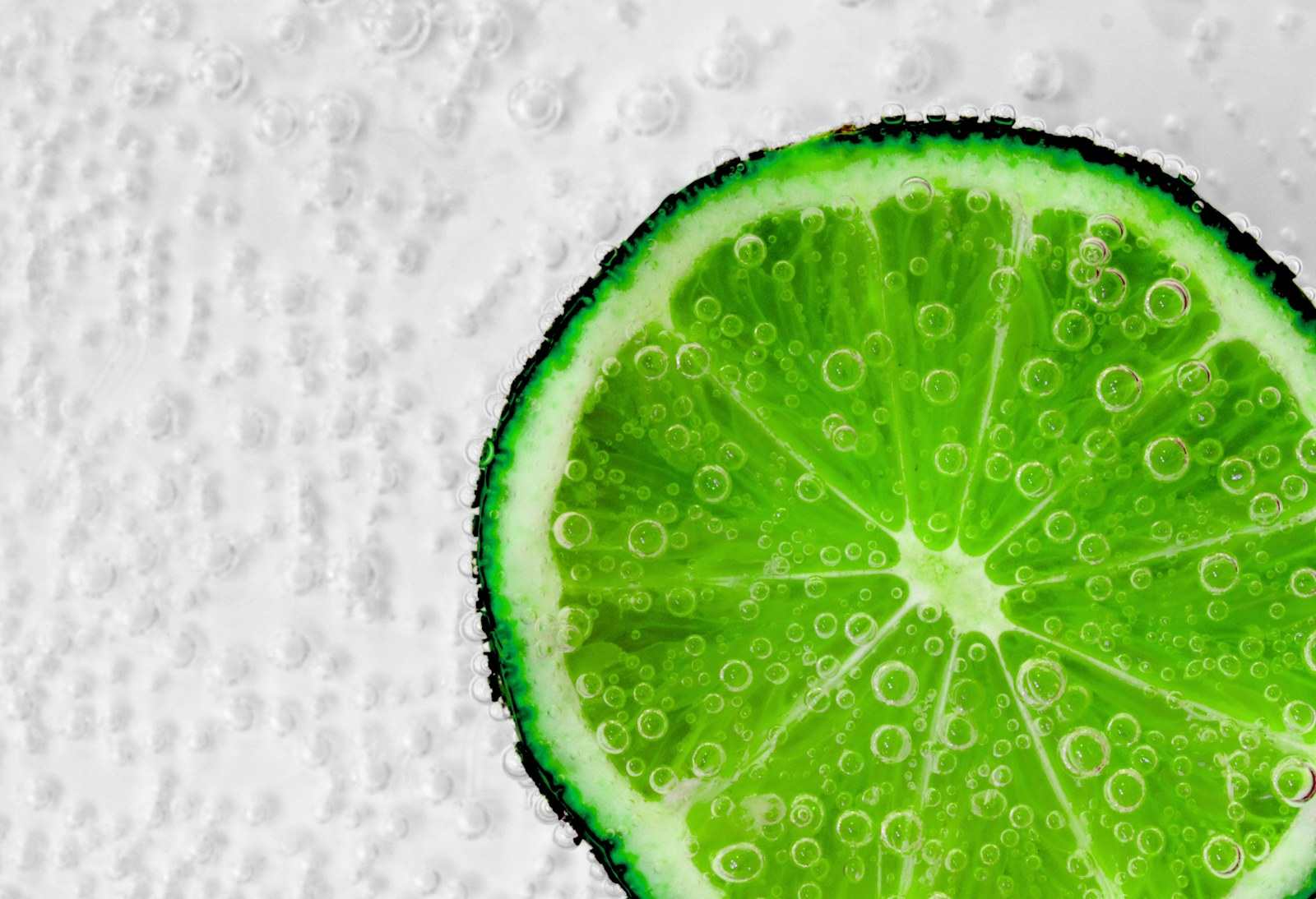 Lime slice in fizzy lemon-lime soda