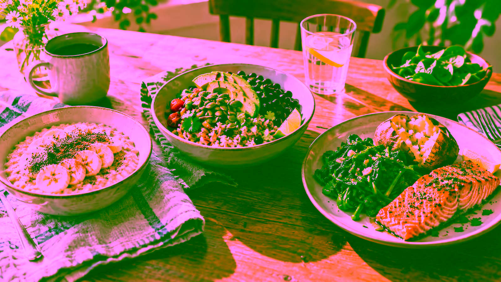 Oatmeal with chia and banana, a black bean grain bowl, and spinach dinner on a warm kitchen table