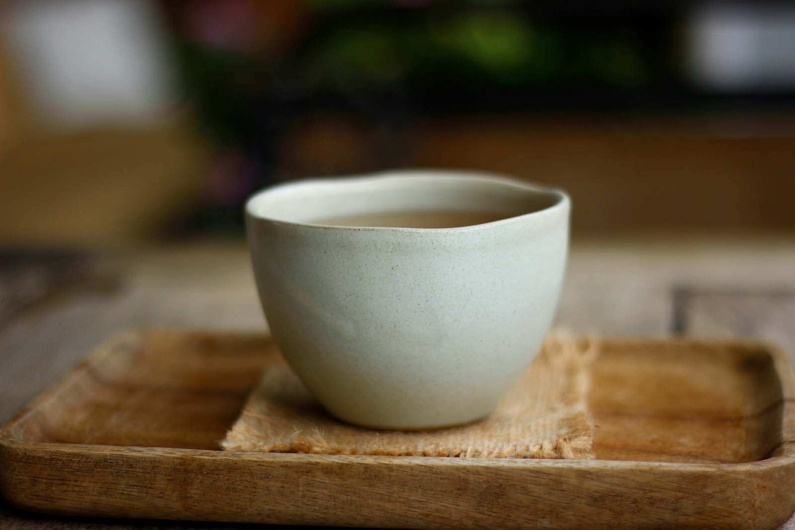 Amber oolong tea in a white ceramic cup