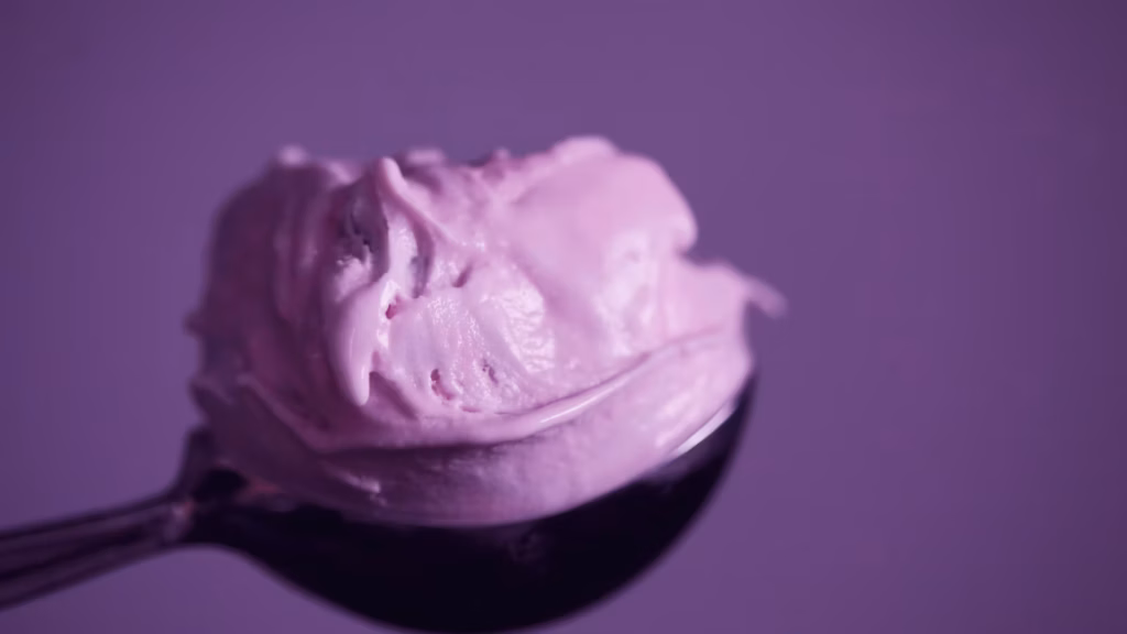 Purple ice cream served in a small bowl