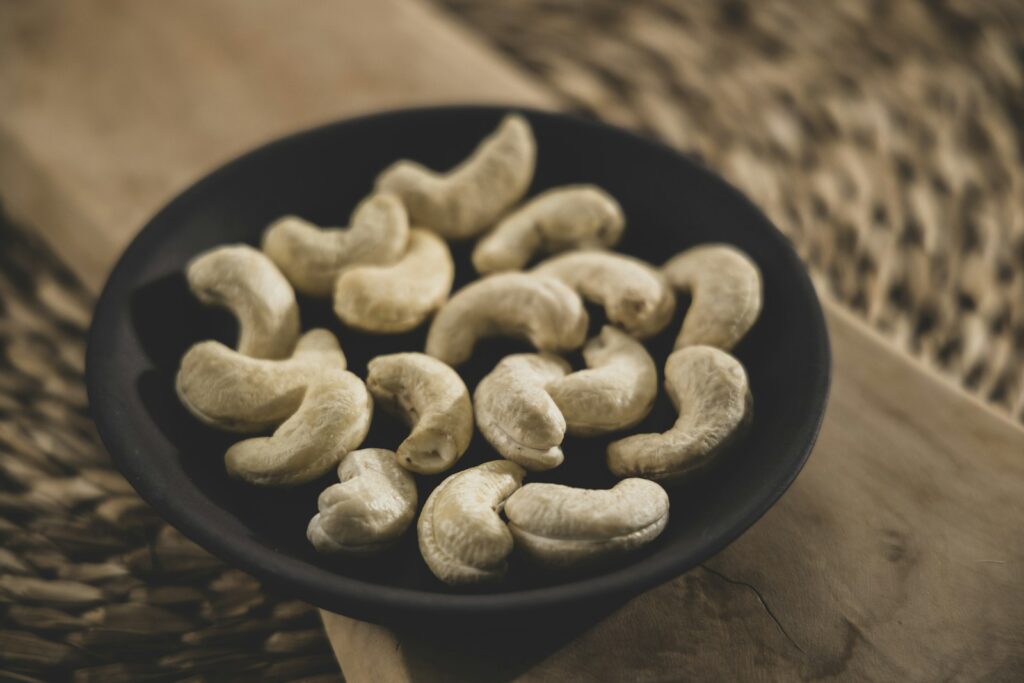Pile of pale unroasted cashew kernels