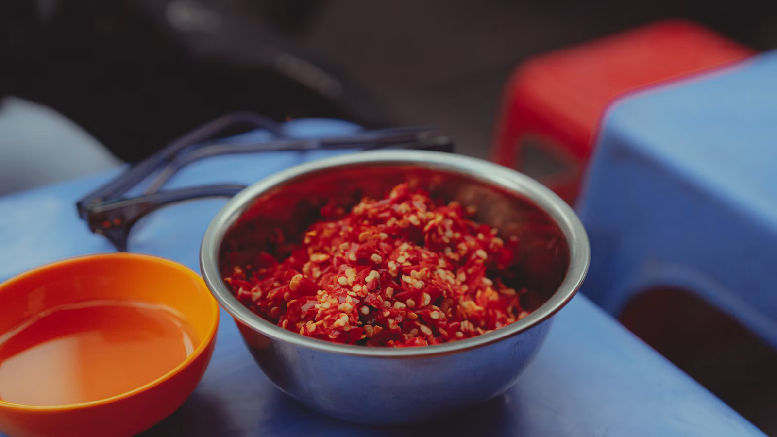 Bowl of deeply red chile-seasoned food