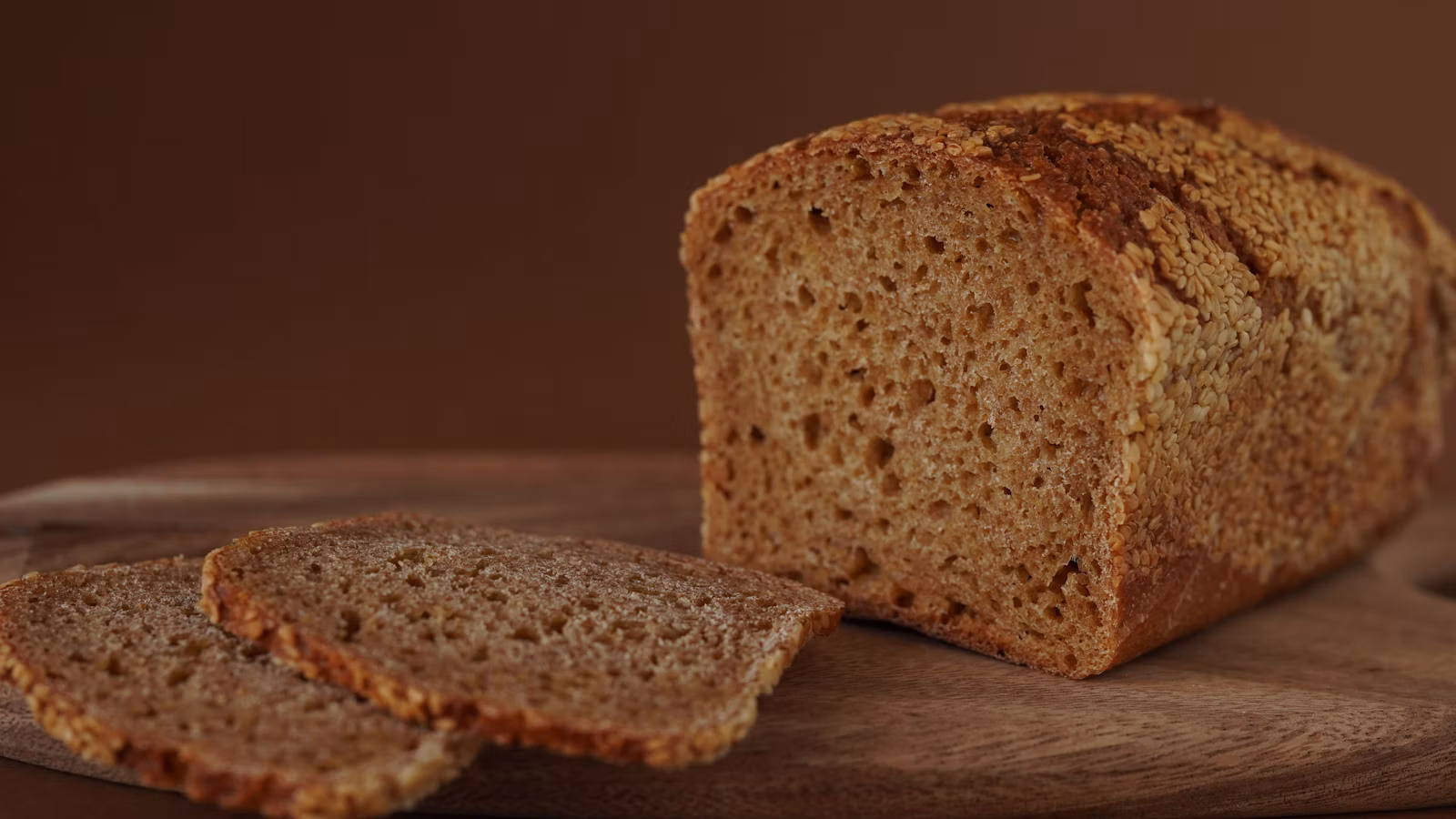 Slices of homemade bread on a rustic wooden board