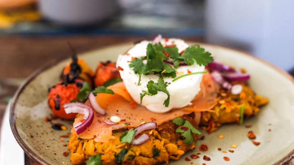Breakfast plates with eggs and vegetables on a table