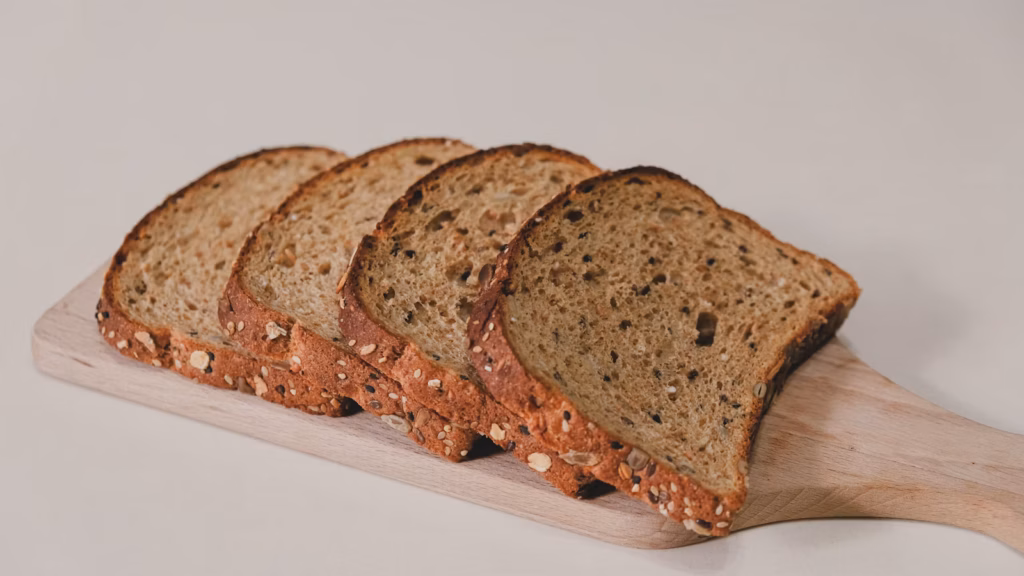 Sliced homemade bread arranged on a white table