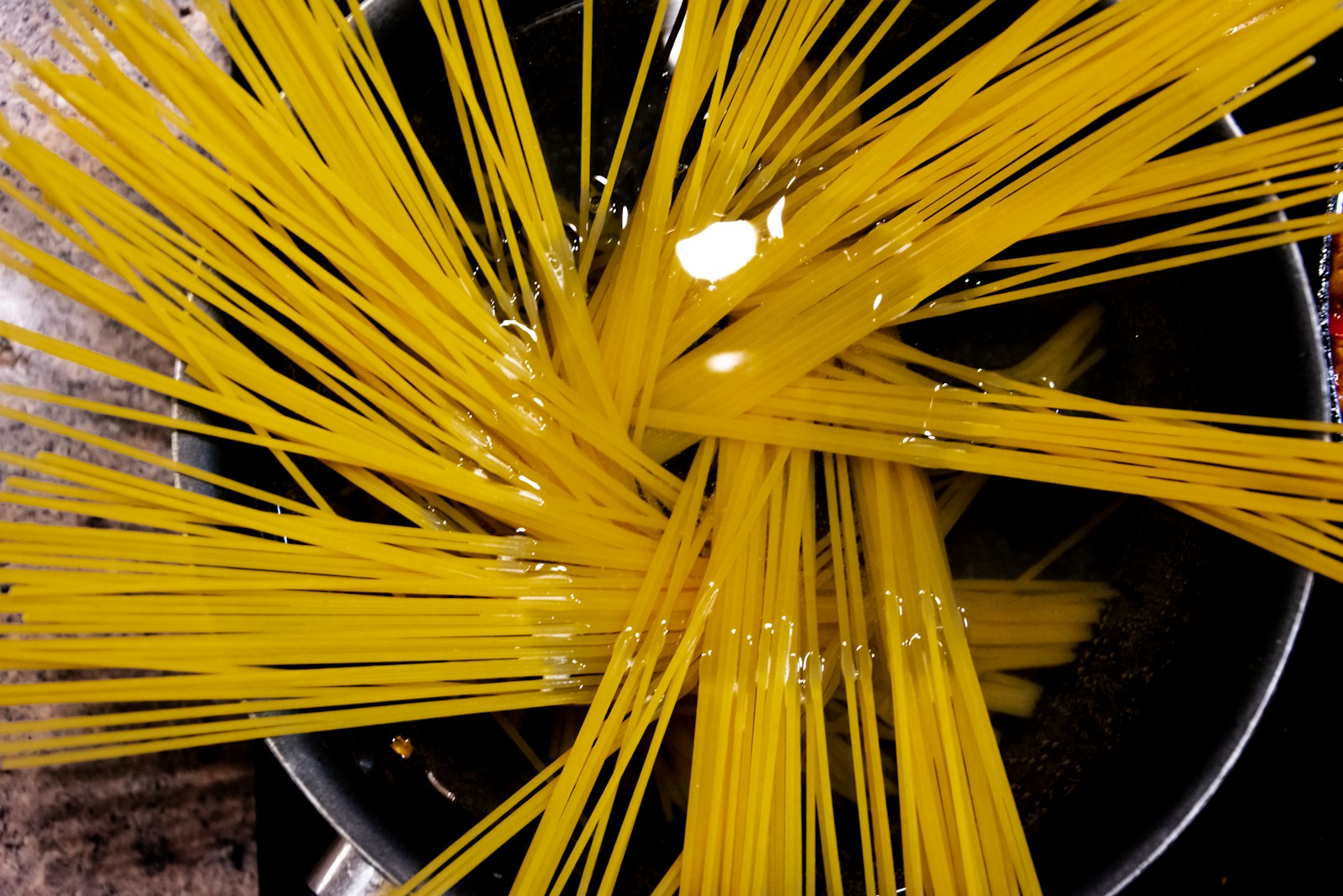 Dry pasta arranged in a cooking pot