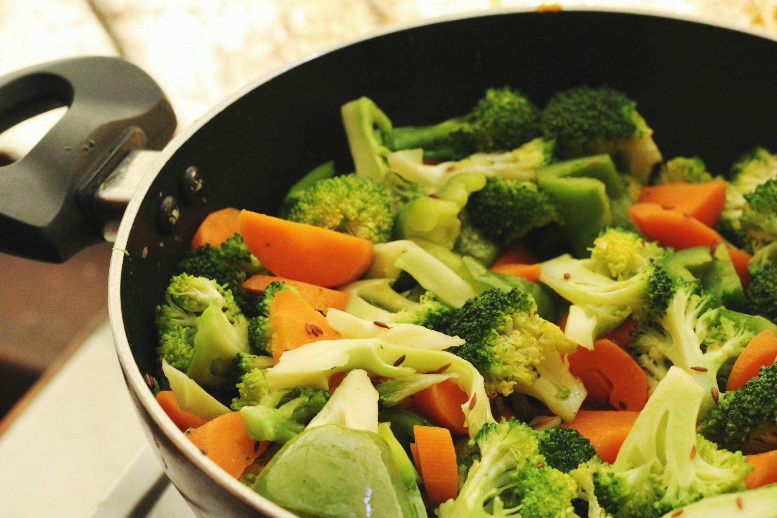 Colorful vegetables cooking in a frying pan