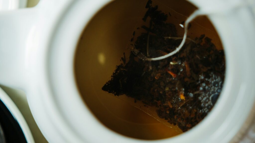 White ceramic teapot filled with tea