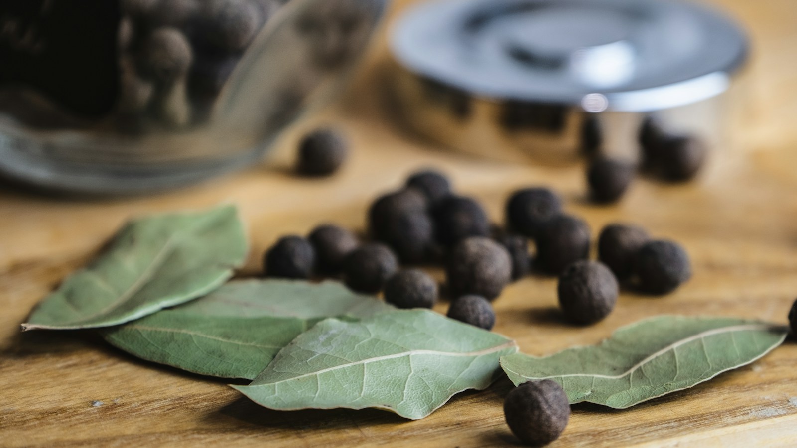 Allspice berries and bay leaves in close-up