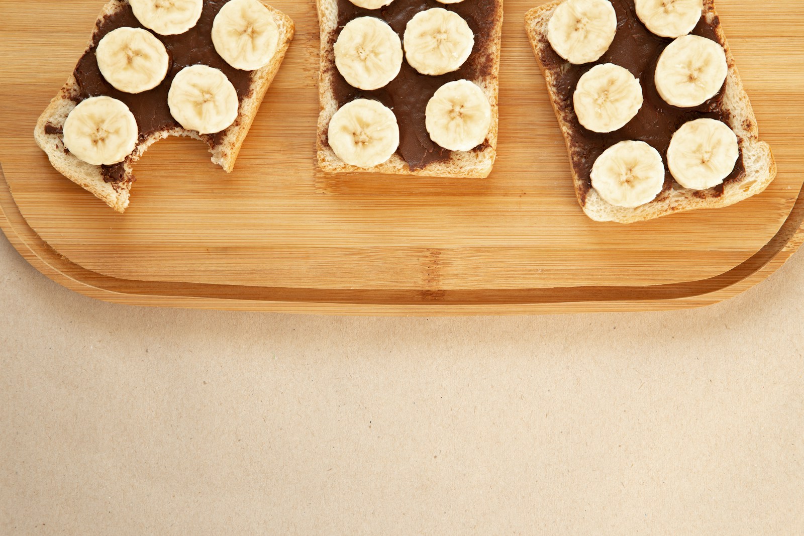 Slices of banana on chocolate-spread toast