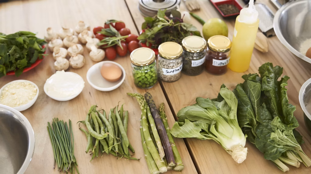 Fresh leafy vegetables on a wooden table
