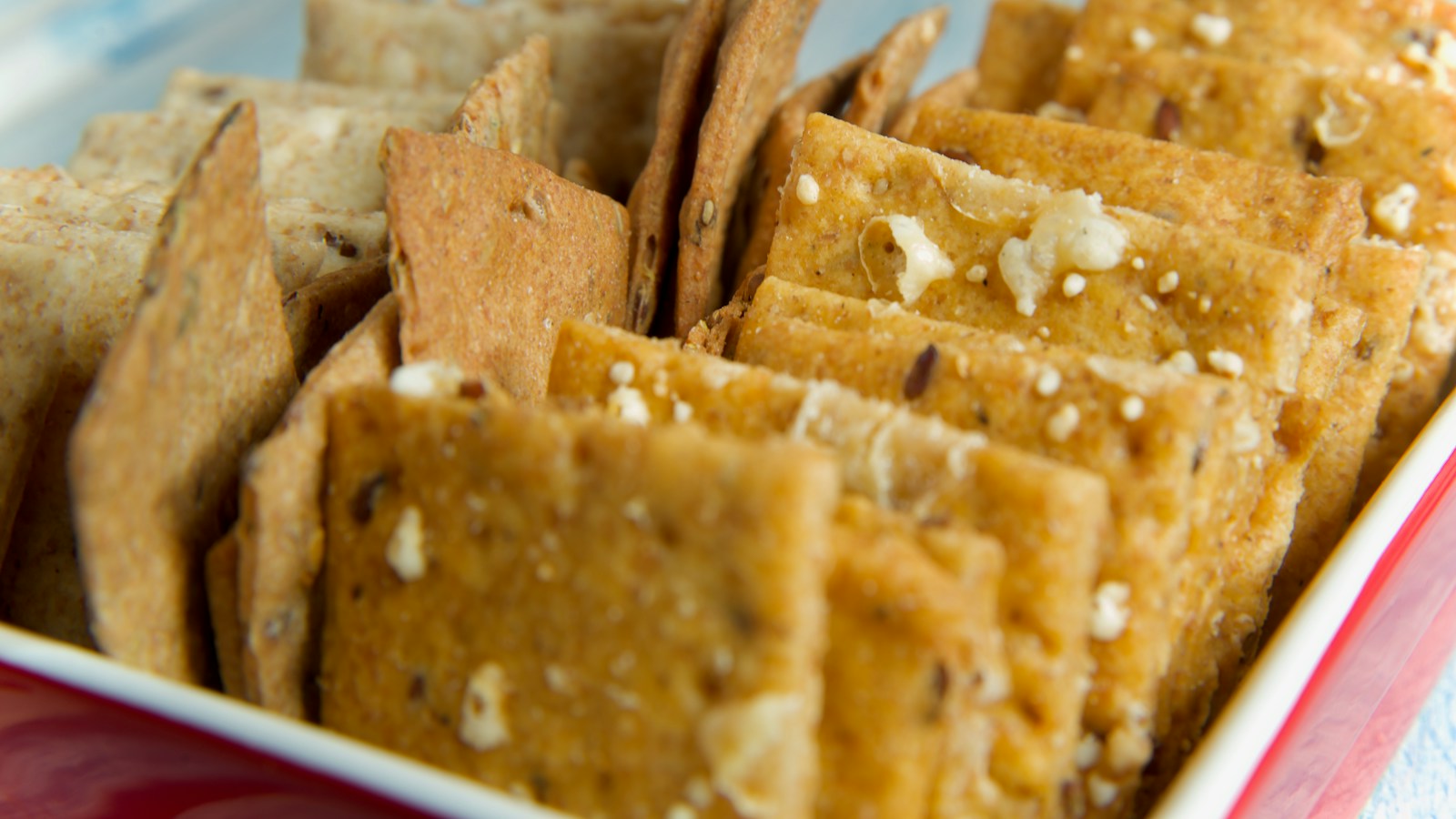 Golden crackers arranged on a plate