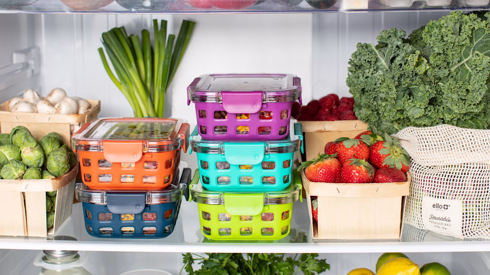 Food containers beside vegetables for a freezer-friendly meal plan