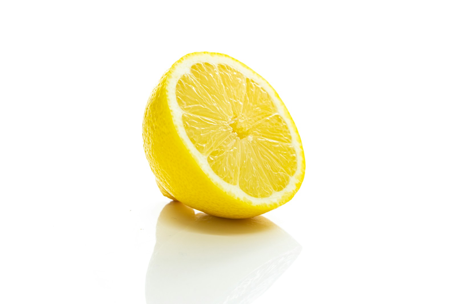 A fresh lemon half with the cut side visible