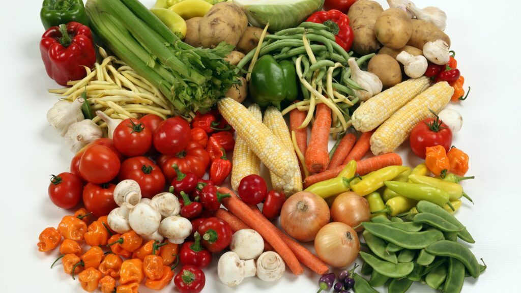 An assortment of fresh vegetables on a white background