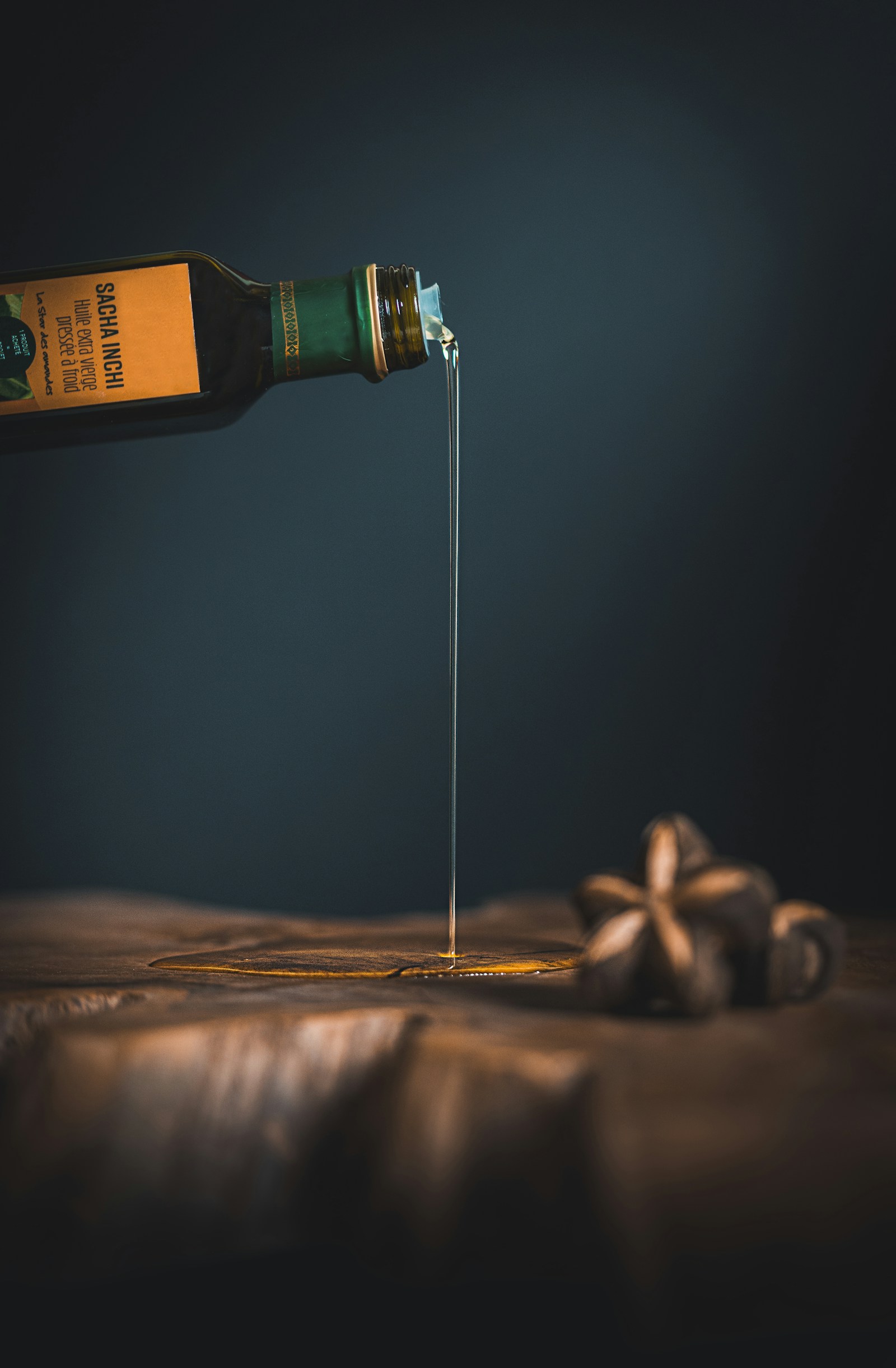 Olive oil being poured from a bottle