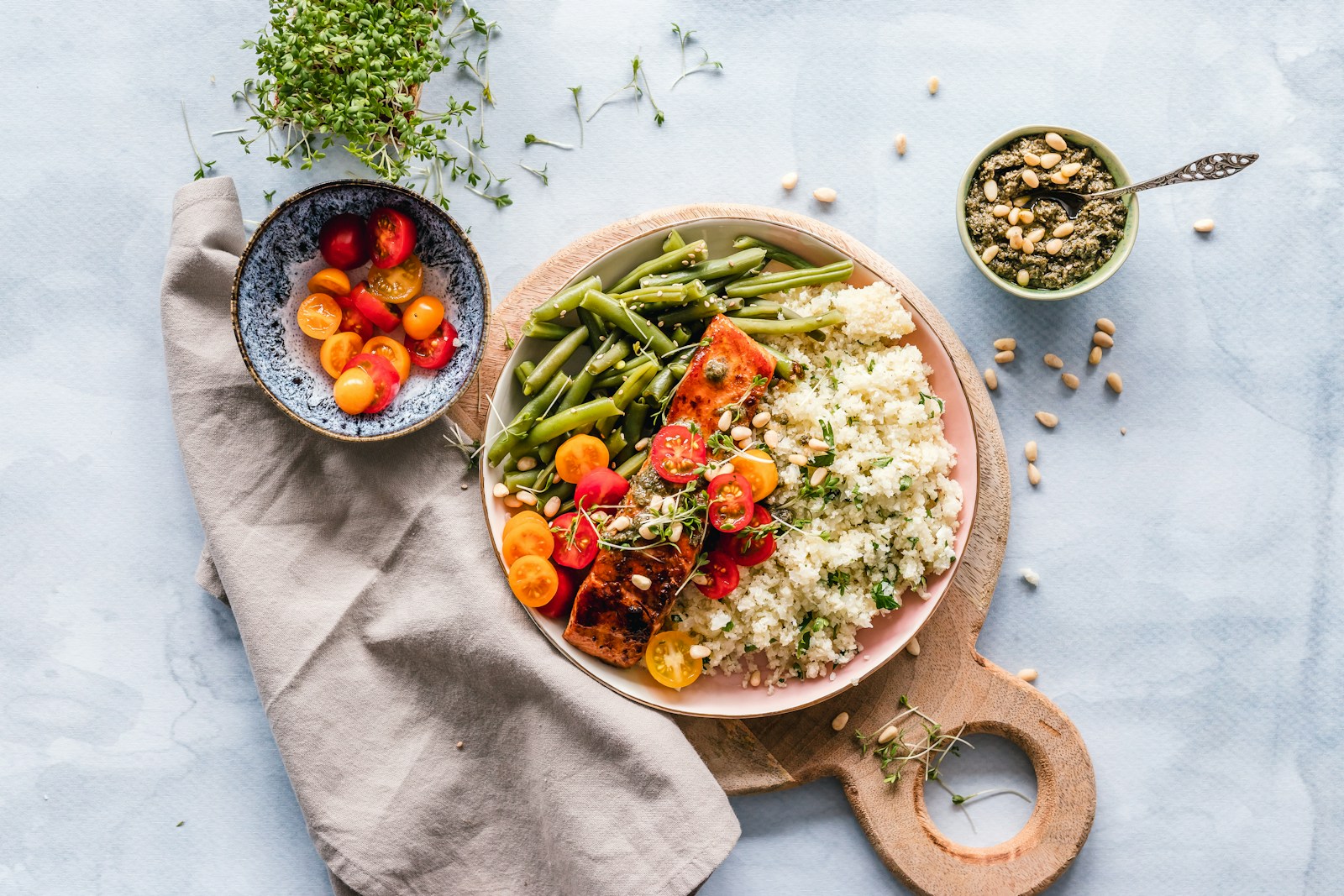 A quinoa bowl served with salmon and vegetables