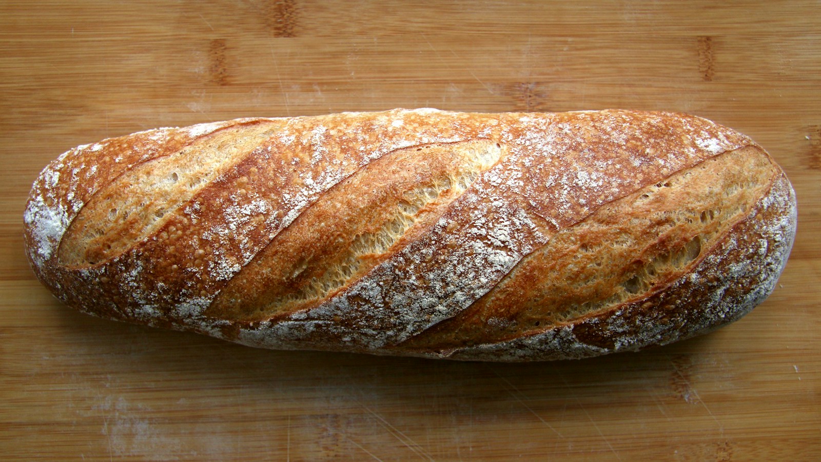 A rustic sourdough loaf with a flour-dusted crust
