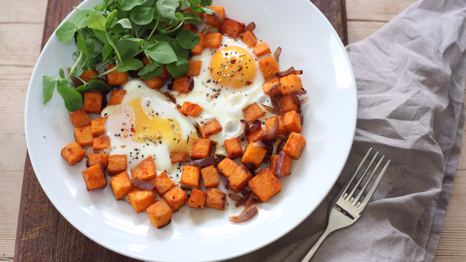 Eggs and vegetables on a plate for a savory breakfast meal plan