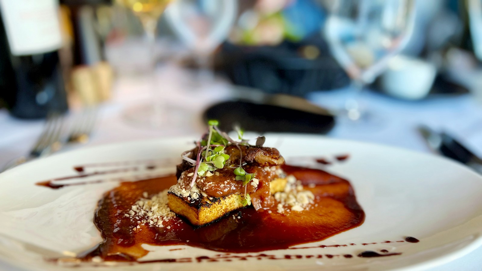 Seared foie gras served on toast with sauce