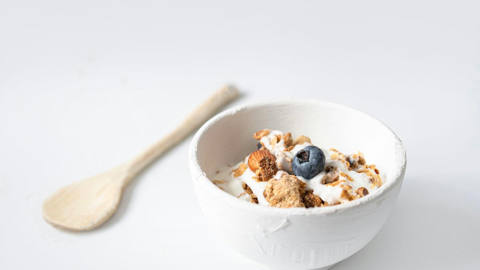 A yogurt bowl topped with fruit and granola